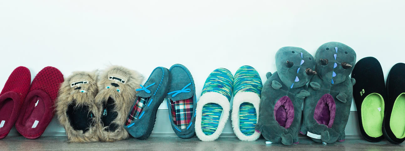 Slippers lined up on a wall